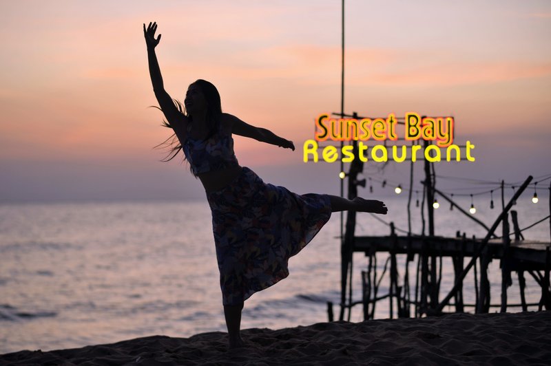 Woman dancing, silhouette at twilight